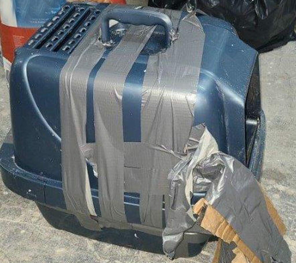 cat littler box taped up with duct tape.